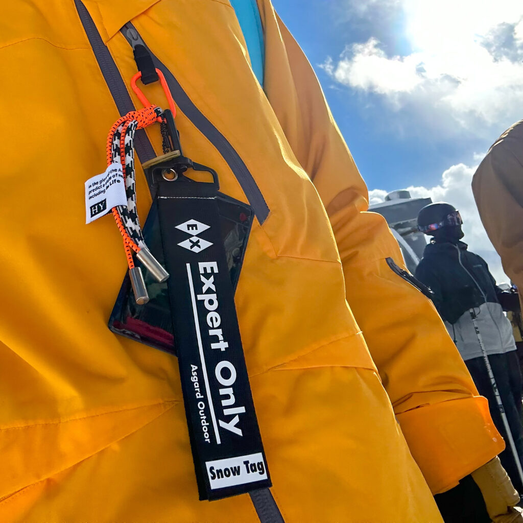 Asgard Ski Pass Holder with Expert Only label on yellow jacket