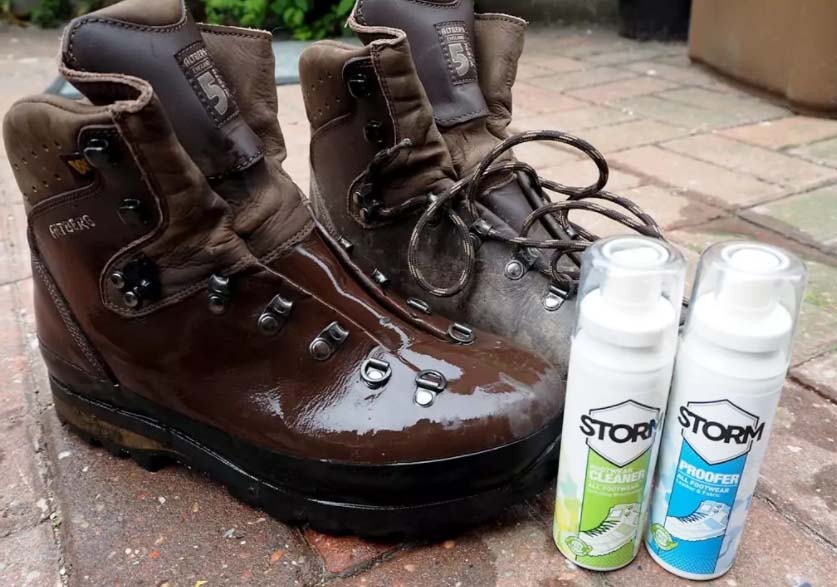 A pair of hiking boots alongside cleaner