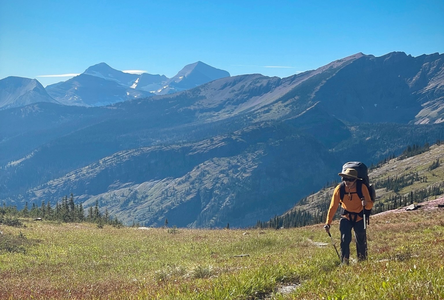 Backpacker Crossing Logan Pass
