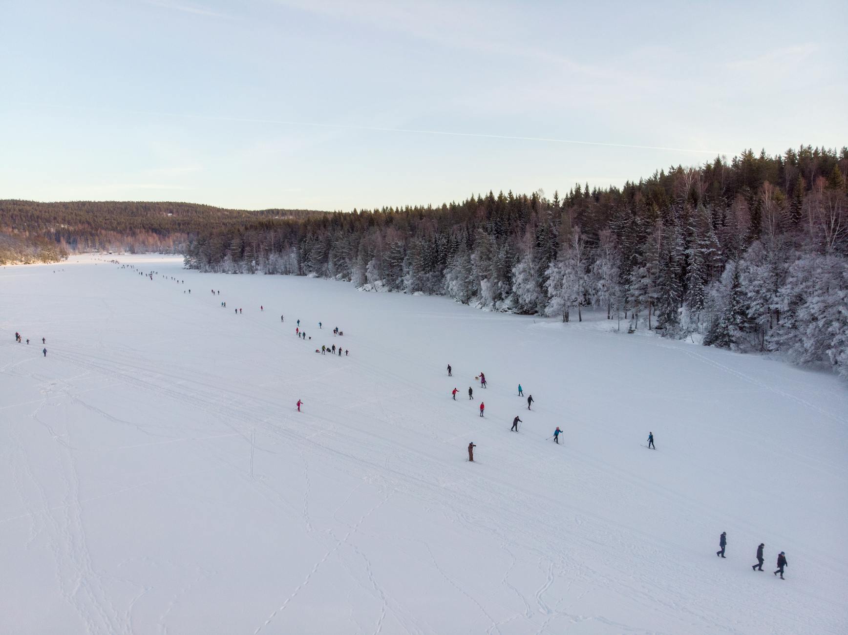 Aerial shot of bustling ski resort in winter-photo-by-pexels