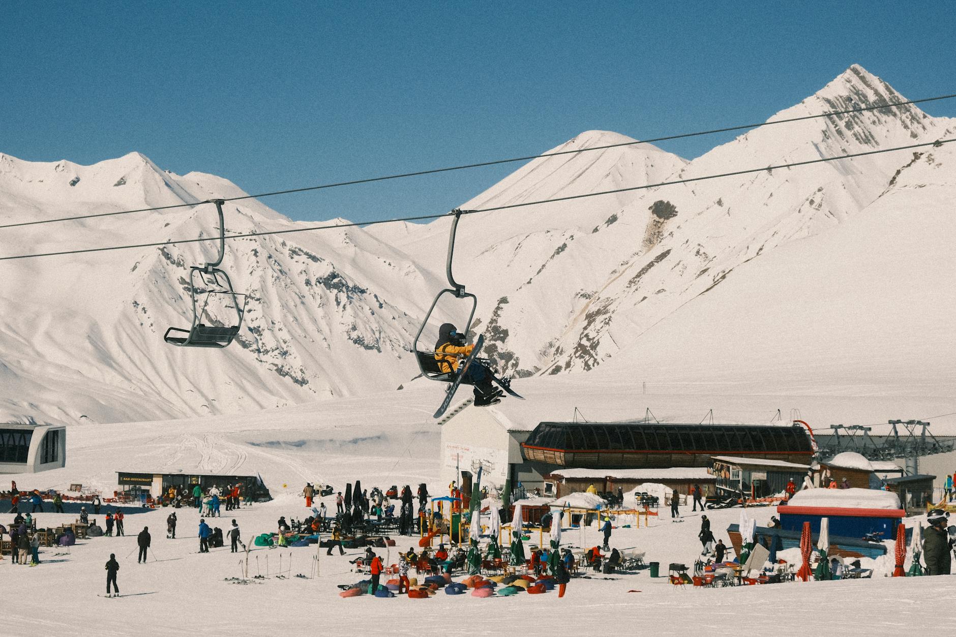Family enjoying skiing at resort with snowy slopes-photo-by-pexels