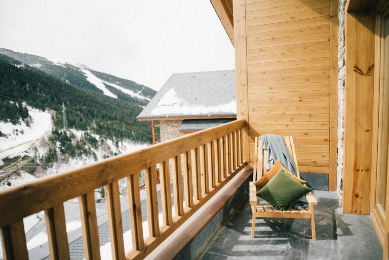 Split view of a luxury ski lodge exterior and a rustic snowy mountain scene highlighting Snowbasin ski resort contrast-photo-by-pexels