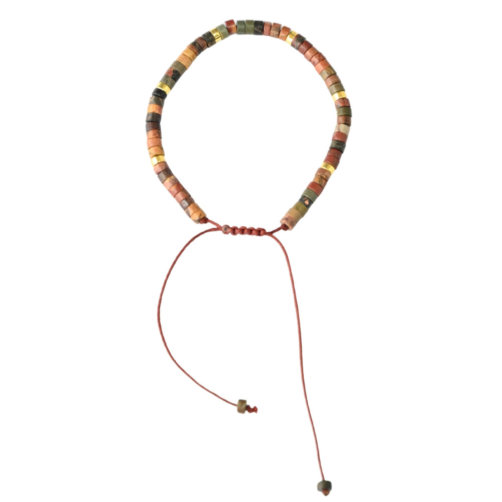 Asgard Terra ID earth-tone mineral bracelet with slim disc beads, metallic accents, and adjustable brown sliding cord on plain background.