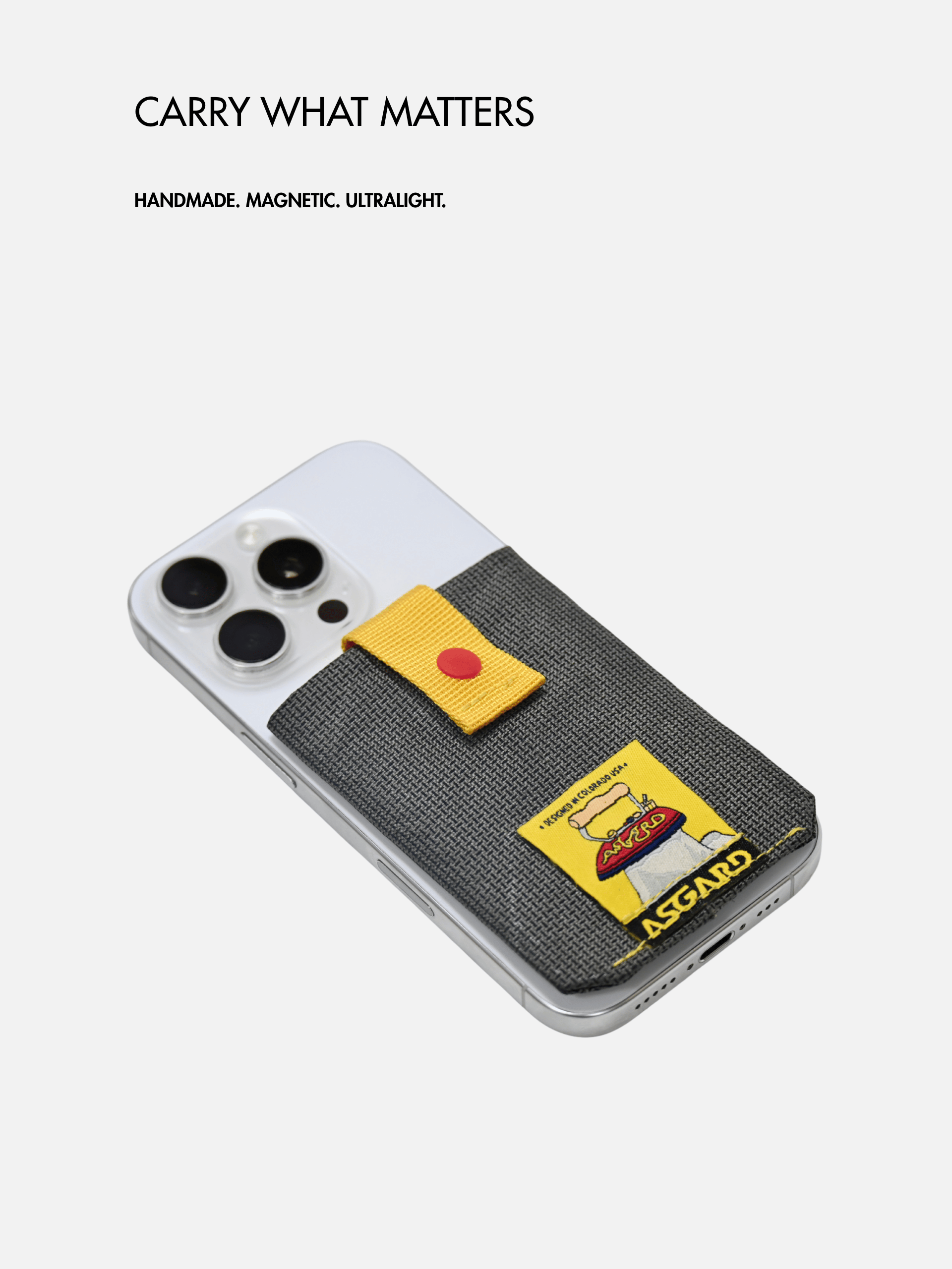 Asgard card holder attached to the back of a silver phone beneath “Carry what matters” text.