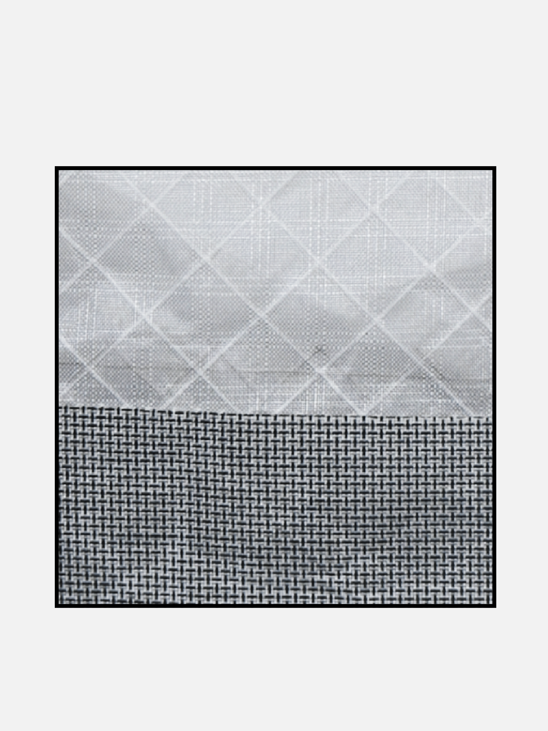 Close-up of the mini tote’s light gray patterned fabric joined to a dark woven lower panel.