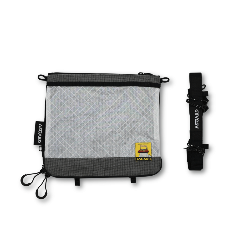 Front of the Asgard Versa Bag 5L with a white grid-patterned panel, gray trim and a separate black shoulder strap.