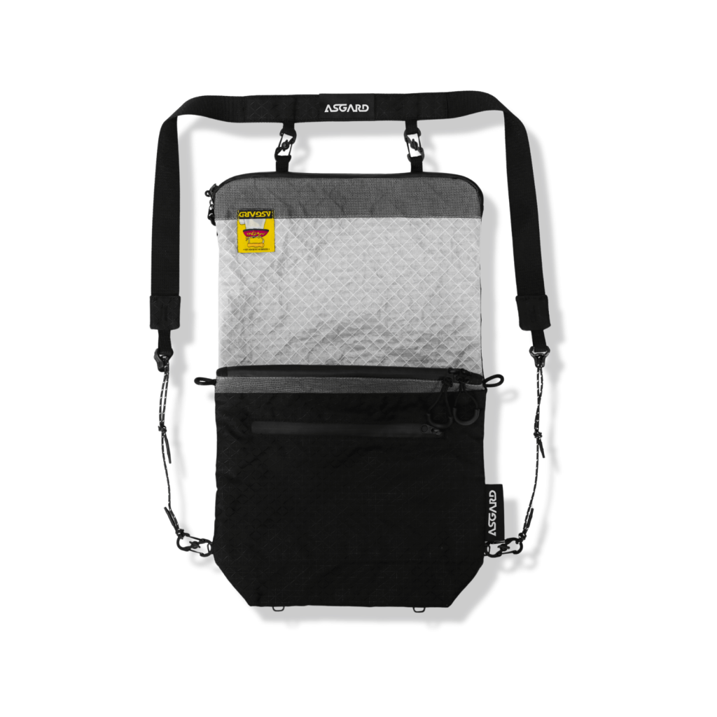 Front view of the Asgard Versa Bag 5L in backpack mode, with a white upper panel, black lower section and attached shoulder strap.