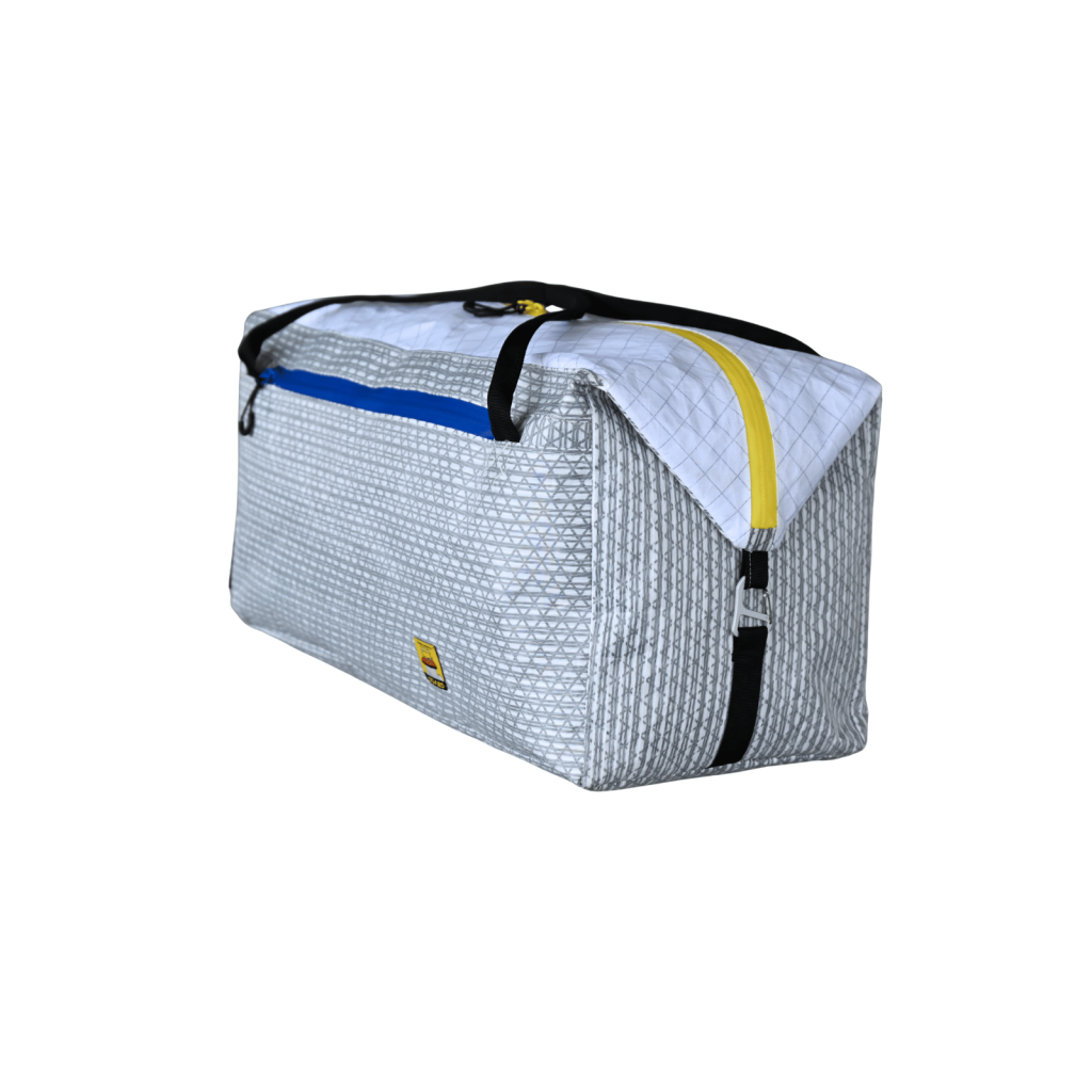 Front-right view of the Asgard Duffel Bag showing its side panel, yellow main zipper and black carry handles.