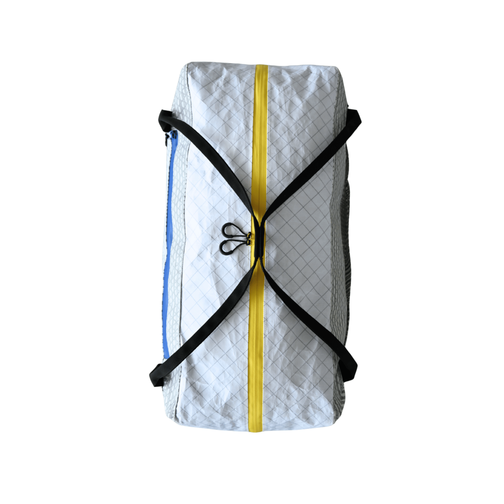 Top view of the Asgard Duffel Bag showing black carry handles across a yellow main zipper with two loop pulls.