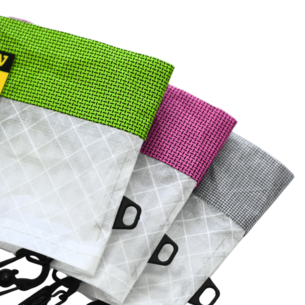 Close-up of Green, Pink, and Gray Asgard Mini Tote Bag panels, showing their woven texture and side loops.