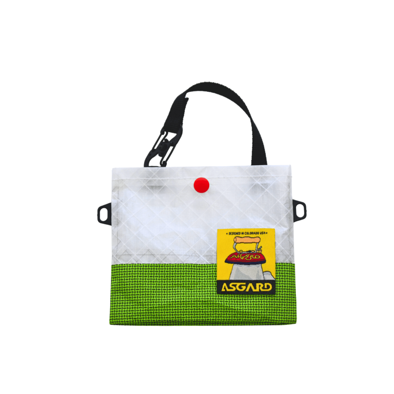 Green Asgard Mini Tote Bag with a white upper panel, black handle, red snap, and yellow logo patch.